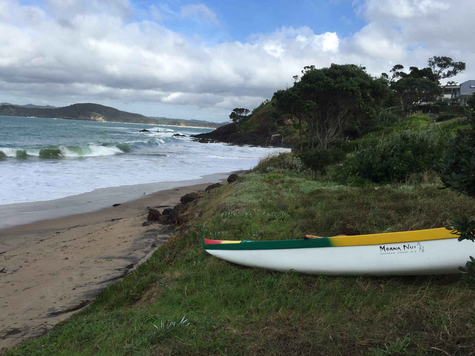 Northland coast with canoe above the beach